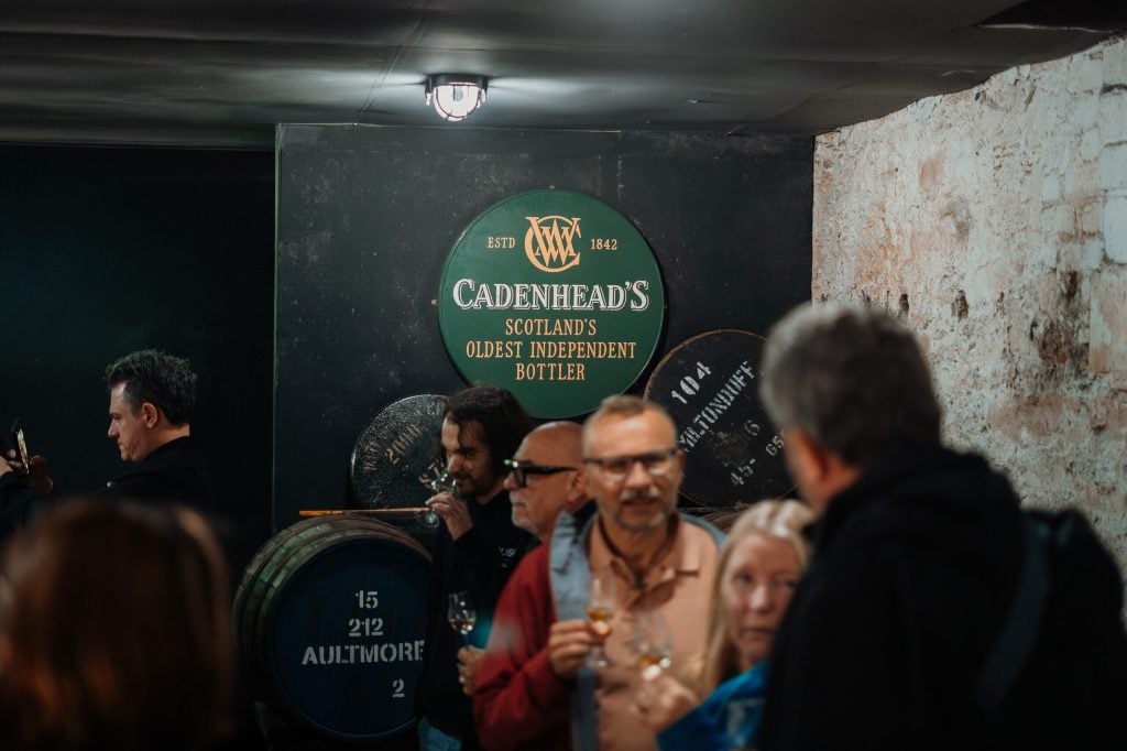 Friends sharing a dram at a Cadenhead's tasting