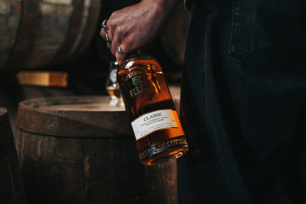 A bottle of Cadenhead's Classic Blended Rum carried through the warehouse